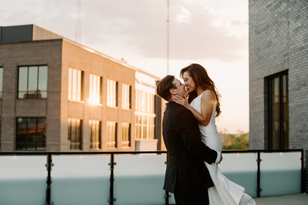 happy bride and groom on rooftop